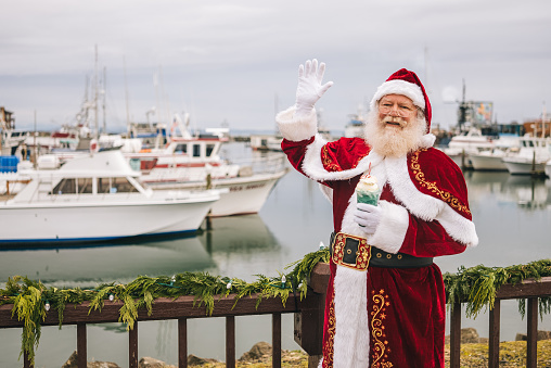 Santa Claus with ice-cream cone at marina