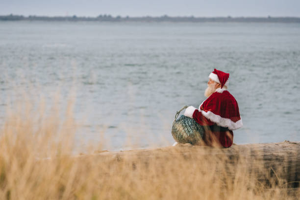 Santa claus relaxing on the beach.