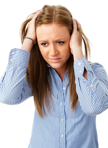 istock Young Distraught Woman Holding Her Head 184318332