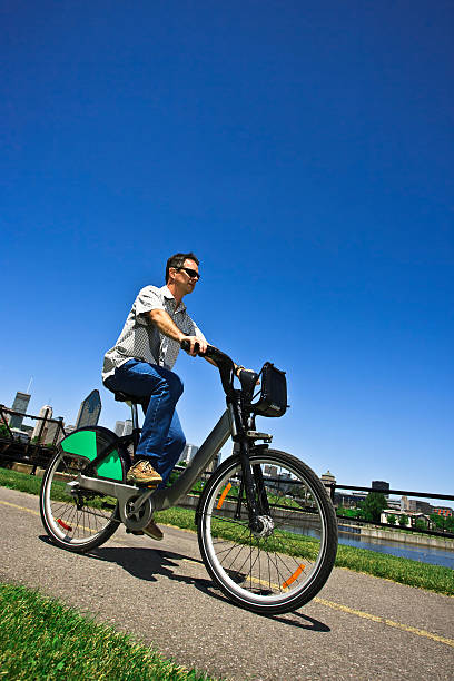 Biking to work in the city stock photo