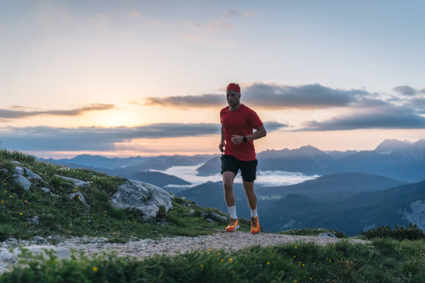istock Female trail runner bounds along mountain pathway 1843186893