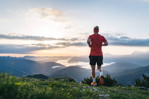 istock Female trail runner bounds along mountain pathway 1843186904