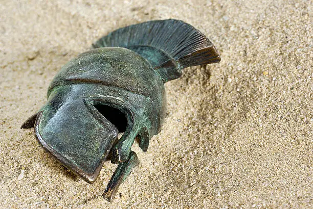 Greec helmet in sand