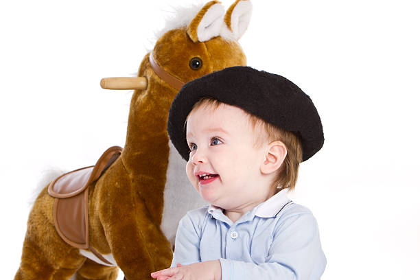 12 months toddler with hobbyhorse