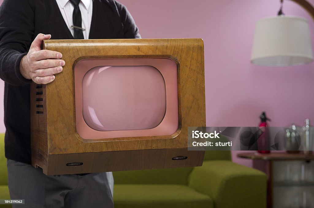 vintage pink television 1950s man brings home a new telly Retro Style Stock Photo