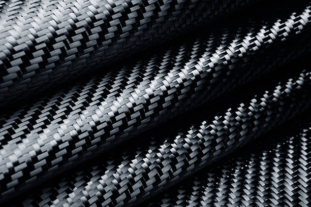 Carbon Fiber Material. Folded raw carbon fiber cloth. carbon fibre photos stock pictures, royalty-free photos & images