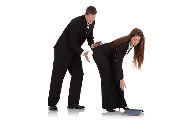 Businessman teasing a businesswoman Businessman teasing a businesswomanhttp://www.twodozendesign.info/i/1.png man touching womans buttock stock pictures, royalty-free photos & images