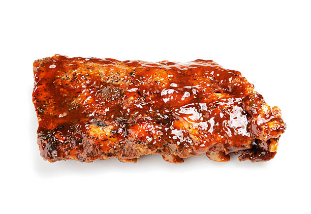 Grilled barbecue ribs "Half rack of grilled baby back ribs with barbecue sauce, isolated on a white background. More ribs..." barbecue pork stock pictures, royalty-free photos & images
