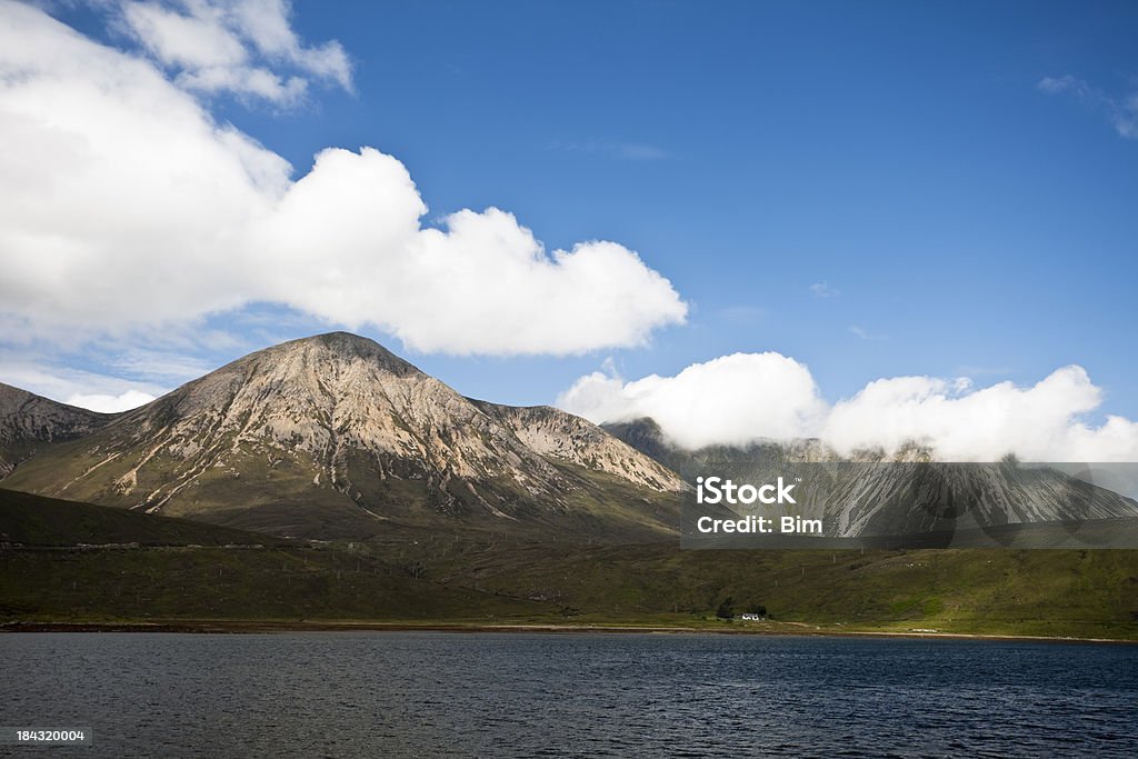 Big Skies over Lake and Mountains in Isle of Skye largest and most northerly island in the Inner Hebrides of Scotland, Beauty In Nature Stock Photo