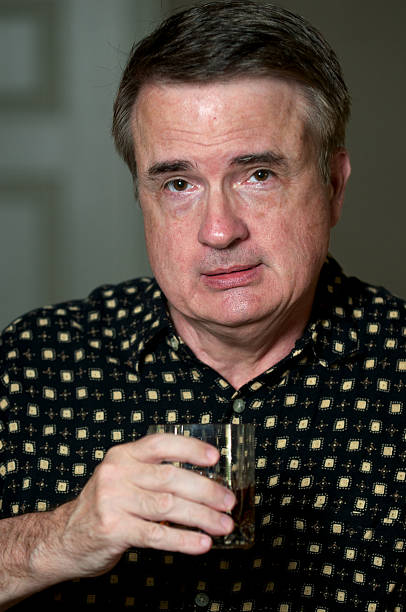 istock Senior Man in Casual Clothes Having a Cocktail 184320172