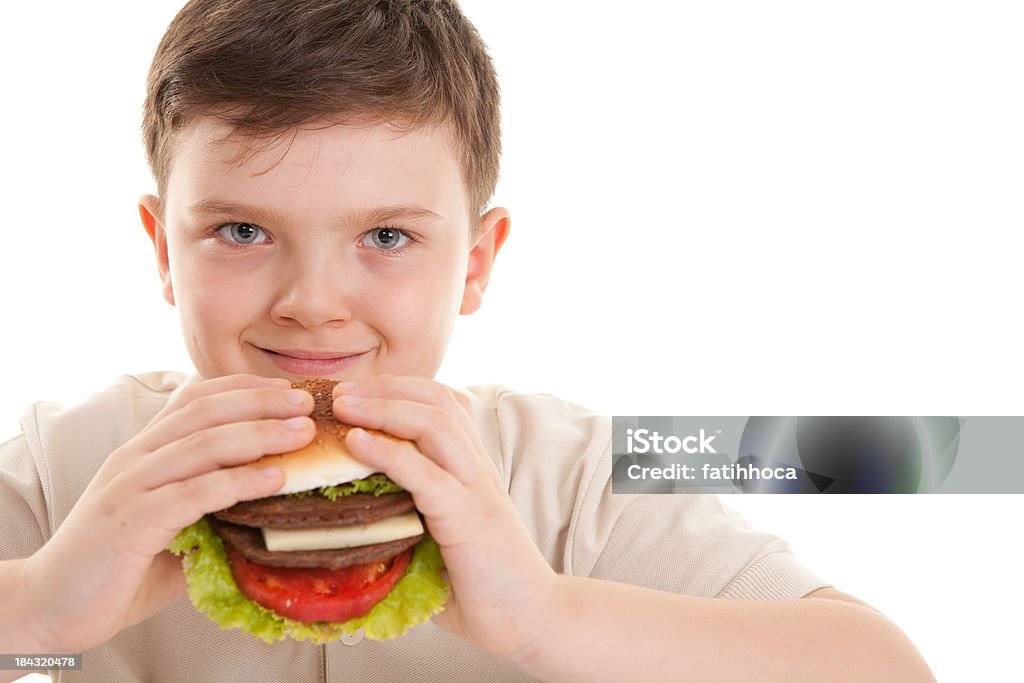 Heureux petit garçon et Hamburger - Photo de Aliment libre de droits