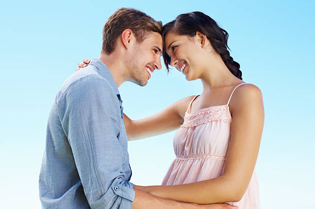 istock Young couple looking at each other 184320628