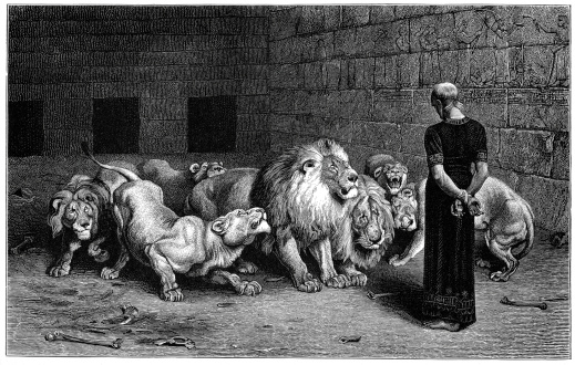 Vintage engraving from 1879 of Daniel before the Lions