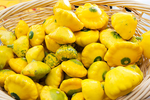 Yellow summer squash in a basket.