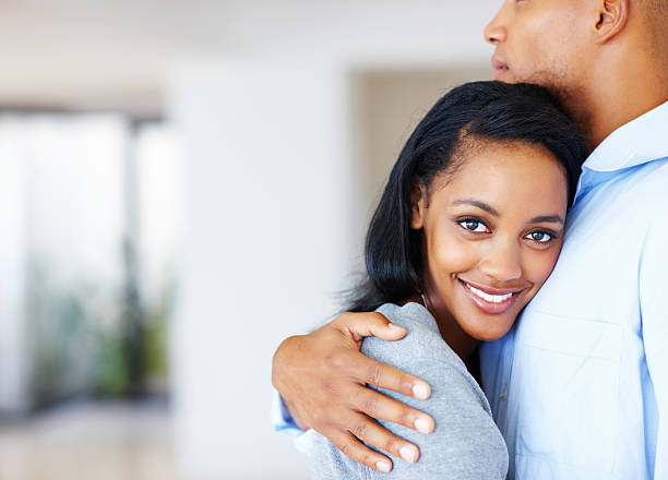 istock Smiling woman hugging man 184321988