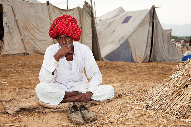 istock Indian Man Sitting Outside At The Pushkar Fair India 184322095