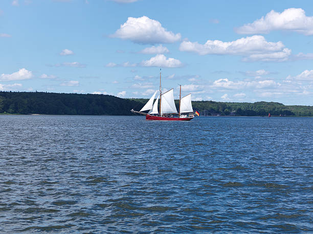 istock historic sail ship, coastal landscape 184322344