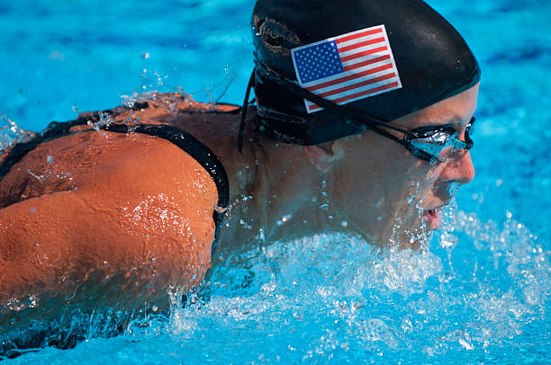 Front view of young female at breaststroke race.