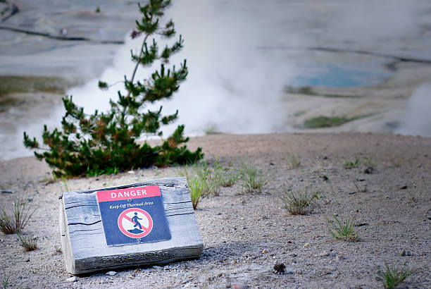 Hot Springs Warning Sign "A warning sign at Norris Geyser Basin, in Yellowstone National ParkAdobe RGB color space." norris geyser basin photos stock pictures, royalty-free photos & images