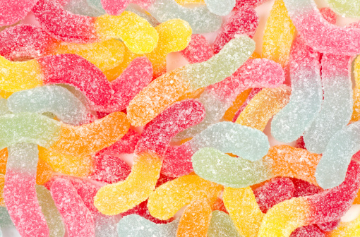 Close-up of some fizzy sour snakes confectionery - studio shot.