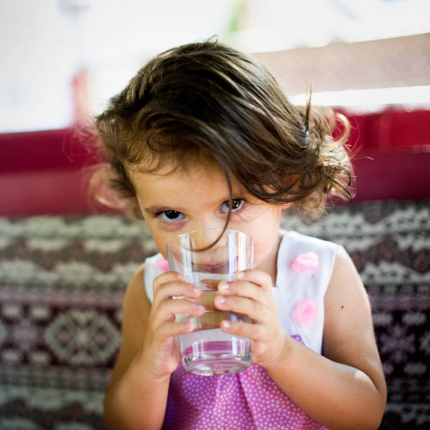 istock Little Girl Drinking Some Water 184323490