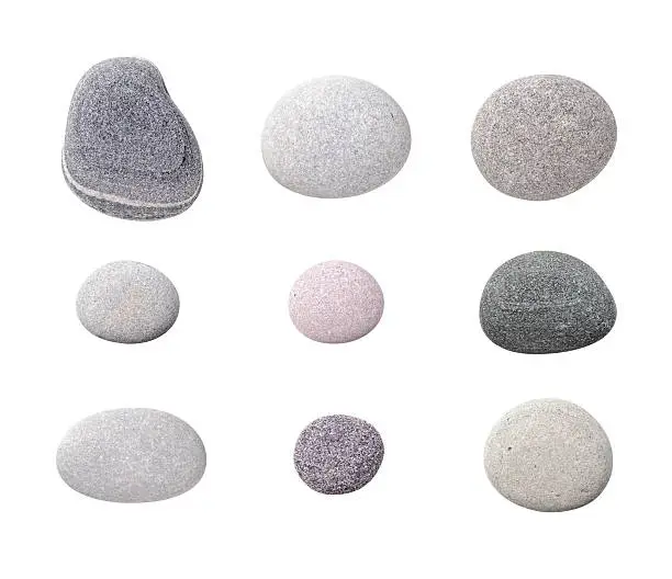 "Assorted pebbles, isolated on white background."