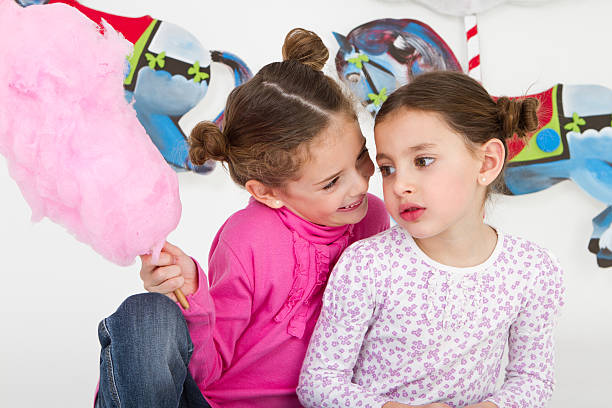 istock Happy friends having fun at amusement park - studio shot 184323631