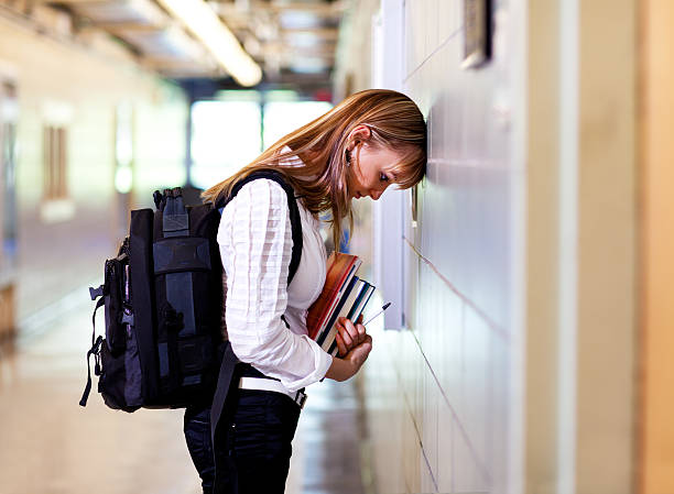 istock Young woman student under stress at school 184323969