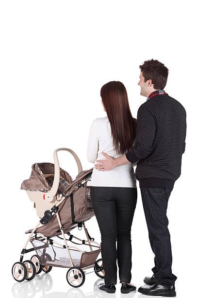 istock Couple standing near a pram 184323976