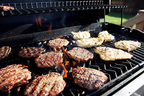 istock Hamburgers and Chicken on a Backyard Grill 184323999