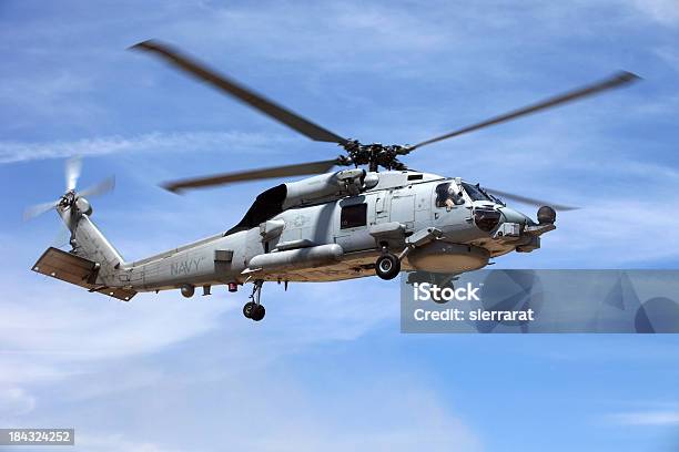 Looking Up At A Seahawk Helicopter Flying In Blue Sky Stock Photo - Download Image Now