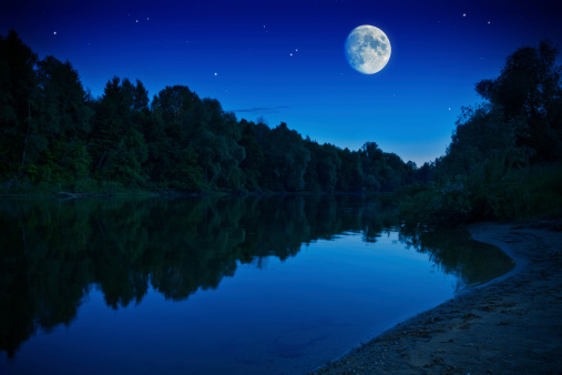 Night shot of rising moon over forest riverMore night shots: