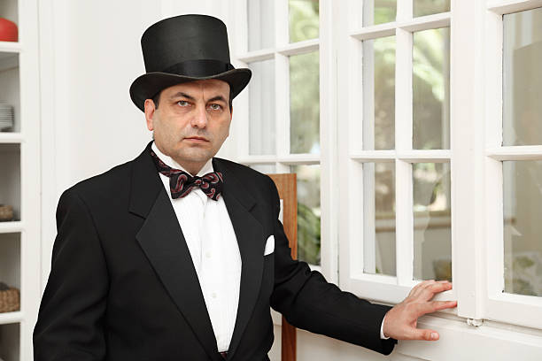 istock Victorian age gentleman stands near the window 184324863