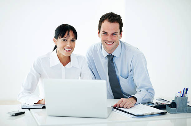 istock Business people in office with laptop 184325025