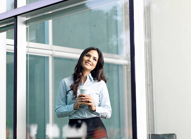 istock Business woman holding a coffee 184325050