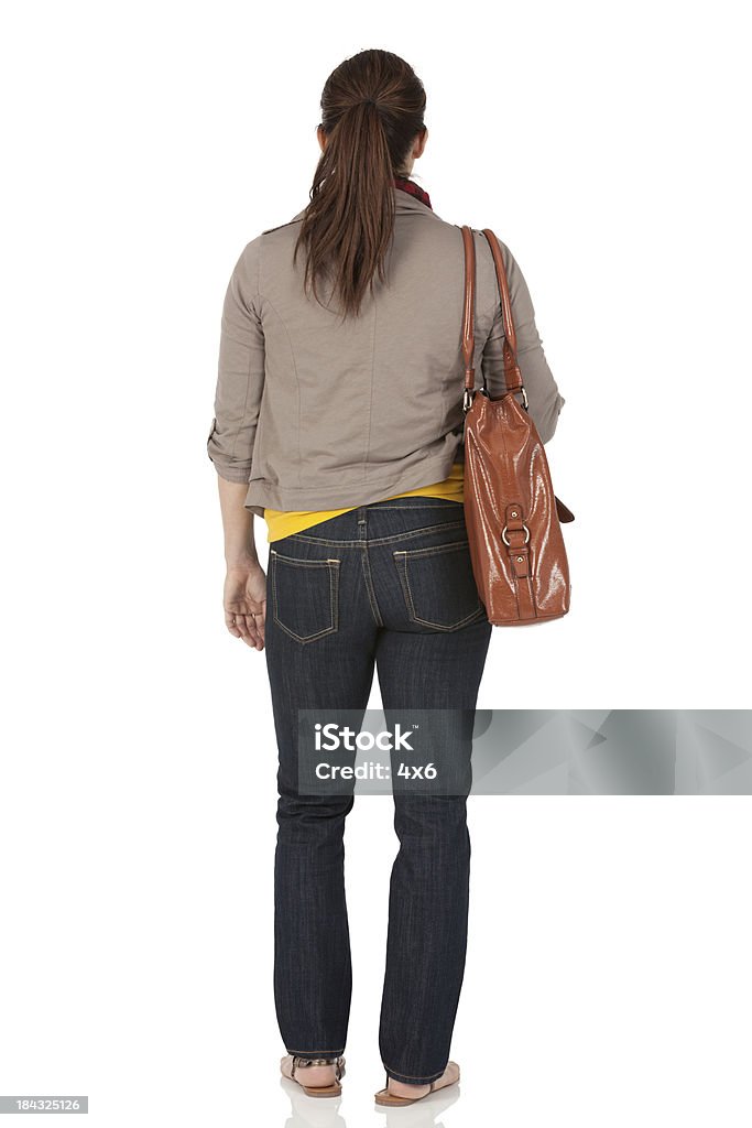 独立した女性にバッグ - 後ろ姿のロイヤリティフリーストックフォト