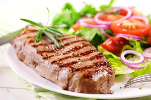 Grilled steak with salad - pouring pepper- XXXL image