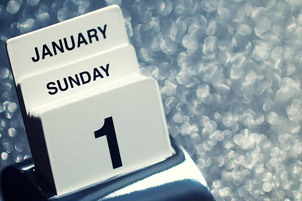 New Year's Day Calendar Sparkle Background "Old-fashioned calendar displays the date for Sunday, January 1, New Year's Day against sparkly background" january 2012 calendar stock pictures, royalty-free photos & images