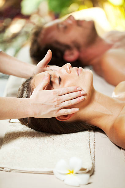 istock Couple receiving a head massage at luxury spa. 184325587