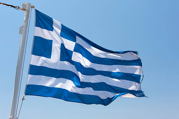 istock Greek Flag against clear blue sky 184325834