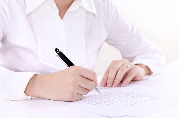 istock Business woman writing 184325866