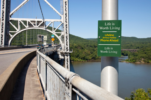 Suicide Prevention sign along path to bridge.Similar files in my porfolio: