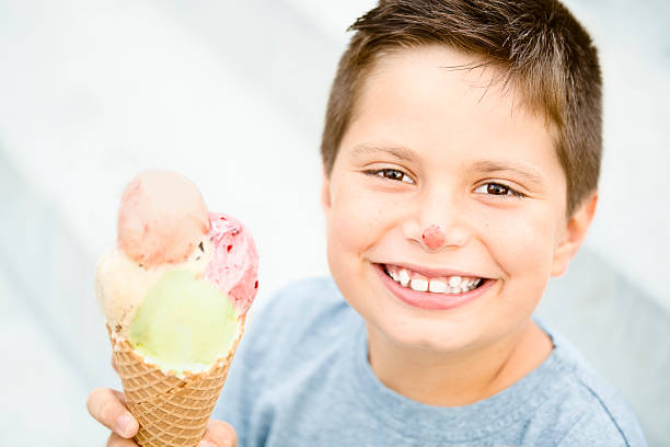 istock Little boy eating ice-cream 184325950