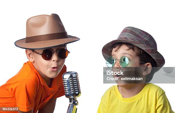 Brothers With Hat Singing On Old Fashioned Microphone Stock Photo - Download Image Now