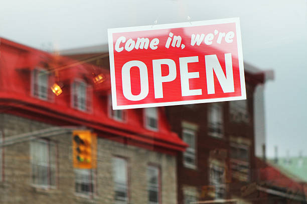 istock Come in, we're open sign on a glass door 184326521