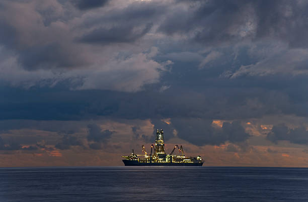 istock Fishing ship with lights on under cloudy sky 184326885
