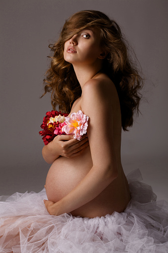 Pregnant woman in the studio