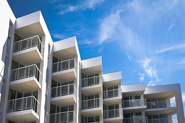 Free Stock Photo of High-rise building with glass balconies and blue ...