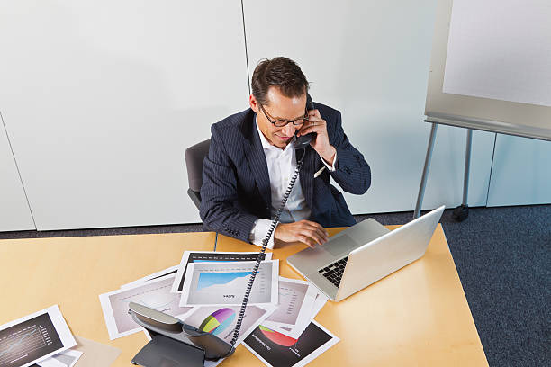 istock Business man  on phone in office 184328941
