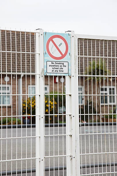 istock No smoking sign on school gates 184328950